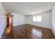 Open living area featuring wood-look floors, white walls and ample natural light at 2144 W Joan De Arc Ave, Phoenix, AZ 85029