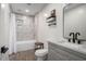 The bathroom features a marble-tiled shower-tub, modern fixtures, and stylish decor for a relaxing atmosphere at 2205 N 22Nd St, Phoenix, AZ 85006