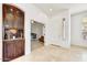 Foyer features built in cabinet with a view to office space at 22503 N 76Th Pl, Scottsdale, AZ 85255