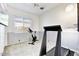 A carpeted exercise room featuring a treadmill, stationary bike, window, and ceiling fan at 22503 N 76Th Pl, Scottsdale, AZ 85255