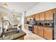 Kitchen featuring stainless steel appliances, granite countertops, and a breakfast nook at 22503 N 76Th Pl, Scottsdale, AZ 85255