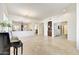 Spacious living room featuring tile flooring, chandelier, piano, with entry to other rooms at 22503 N 76Th Pl, Scottsdale, AZ 85255