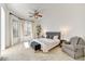 Bright main bedroom featuring large windows, ceiling fan, and neutral décor at 22503 N 76Th Pl, Scottsdale, AZ 85255