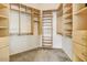 Spacious walk-in closet featuring built-in shelving and ample storage space at 22503 N 76Th Pl, Scottsdale, AZ 85255