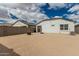 Large backyard with block wall and string lights perfect for outdoor activities at 24029 W Zak Rd, Buckeye, AZ 85326