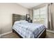 Comfortable bedroom featuring a large window and neutral decor, creating a serene retreat at 24029 W Zak Rd, Buckeye, AZ 85326