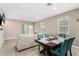 Inviting dining area with views of the living room and sliding glass doors at 24029 W Zak Rd, Buckeye, AZ 85326