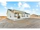 Exterior home elevation, with a patio, showcasing the backyard and desert landscape at 24959 S 190Th Dr, Buckeye, AZ 85326