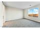 Bedroom featuring carpet, a window, and a closet at 24959 S 190Th Dr, Buckeye, AZ 85326