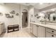 Serene bathroom with decorative shelving, granite counters, and natural light at 26231 W Maple Dr, Buckeye, AZ 85396