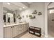 Well-lit bathroom featuring stylish decor, granite counters, and modern fixtures at 26231 W Maple Dr, Buckeye, AZ 85396