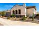 Well-maintained stucco home featuring attractive stone accents and desert-style landscaping at 26231 W Maple Dr, Buckeye, AZ 85396