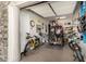 Well-organized garage with storage for bicycles, golf clubs, and a golf cart at 26231 W Maple Dr, Buckeye, AZ 85396