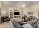 Elegant living room with custom built-ins and comfortable seating arrangement at 26231 W Maple Dr, Buckeye, AZ 85396