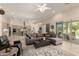 Bright living room showcasing an open floor plan and seamless indoor-outdoor transition at 26231 W Maple Dr, Buckeye, AZ 85396