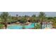 A tropical style pool with many different seating arrangements provides options for relaxation and socializing at 26231 W Maple Dr, Buckeye, AZ 85396