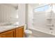 Clean bathroom featuring a tub, sink, and granite countertop at 26905 W Mcrae Dr, Buckeye, AZ 85396