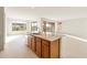 Bright kitchen island with granite countertops and tile flooring, offering ample space and natural light at 26905 W Mcrae Dr, Buckeye, AZ 85396