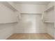 Spacious walk-in closet with shelves and clothing rods for optimal storage at 26905 W Mcrae Dr, Buckeye, AZ 85396