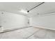 Spacious two car garage with concrete floor and bright lighting at 2762 S 357Th Dr, Tonopah, AZ 85354