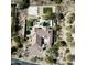 Aerial view of the house showcasing the backyard pool, spa, basketball court, and trampoline at 27728 N 68Th Pl, Scottsdale, AZ 85266