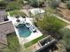 Aerial view of the backyard showing the pool, spa, and basketball court at 27728 N 68Th Pl, Scottsdale, AZ 85266