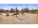 Outdoor basketball court is surrounded by a wrought-iron fence at 27728 N 68Th Pl, Scottsdale, AZ 85266