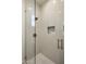 Contemporary walk-in shower featuring a mosaic tile floor and a glass door at 27728 N 68Th Pl, Scottsdale, AZ 85266