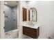 Modern bathroom with a gray-tiled shower and stylish vanity at 27728 N 68Th Pl, Scottsdale, AZ 85266