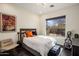 Bright bedroom with a window offering natural light and views of the outdoors at 27728 N 68Th Pl, Scottsdale, AZ 85266