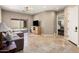 Cozy living room featuring travertine floors, neutral colors and sliding glass door at 27728 N 68Th Pl, Scottsdale, AZ 85266