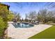 Resort style backyard features a custom pool, spa and lounge seating at 27728 N 68Th Pl, Scottsdale, AZ 85266