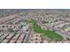 Expansive aerial shot displaying an extensive network of homes and neighborhoods, featuring lush green spaces and parks at 2983 E Harrison St, Gilbert, AZ 85295