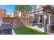 Inviting backyard with artificial grass, a grill, seating, and a pergola at 2983 E Harrison St, Gilbert, AZ 85295