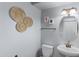 Cozy half-bathroom with decorative wall art and a pedestal sink at 2983 E Harrison St, Gilbert, AZ 85295