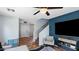 Bright living room with gray walls, a ceiling fan, tile flooring, and a staircase at 2983 E Harrison St, Gilbert, AZ 85295