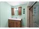 Bathroom featuring a vanity with a stone countertop and tiled walk-in shower at 315 Leisure World --, Mesa, AZ 85206