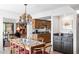 Elegant dining area with a unique chandelier, adjacent to a stylish kitchen and office space at 315 Leisure World --, Mesa, AZ 85206