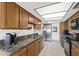 Kitchen featuring granite countertops, stainless steel appliances and light wood cabinets at 315 Leisure World --, Mesa, AZ 85206