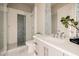 Chic bathroom featuring blue accent tile, glass shower, and elegant vanity, combining style with functionality at 3392 E Gemini Ct, Chandler, AZ 85249