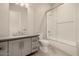 Modern bathroom features a shower with a glass door and subway tile, plus a gray vanity at 3392 E Gemini Ct, Chandler, AZ 85249