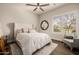 Light-filled bedroom boasts a large bed, window shutters, and stylish decor, creating a serene space at 3392 E Gemini Ct, Chandler, AZ 85249