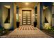 Close-up of the modern front door with stone accents and stylish lighting, creating a welcoming entrance at 3392 E Gemini Ct, Chandler, AZ 85249