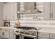 Close up of a gourmet kitchen featuring stainless steel appliances and modern tile backsplash at 3392 E Gemini Ct, Chandler, AZ 85249