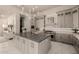 Bright, modern kitchen with gray cabinets, a large island, and stainless steel appliances at 3392 E Gemini Ct, Chandler, AZ 85249