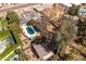 Aerial view of backyard featuring an in-ground pool with lounge chairs and solar panels on the roof at 3419 E Cholla St, Phoenix, AZ 85028