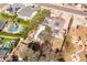 Aerial view featuring a house with solar panels and a pool, nestled among mature trees at 3419 E Cholla St, Phoenix, AZ 85028