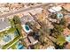 Expansive aerial view showcasing the home's large lot, pool, solar panels, and surrounding neighborhood at 3419 E Cholla St, Phoenix, AZ 85028