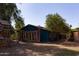 Large backyard with a shed, playhouse, and plenty of space for outdoor activities and gardening at 3419 E Cholla St, Phoenix, AZ 85028