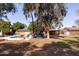 Lush backyard featuring a sparkling pool, patio furniture, and a view of the charming single-story home at 3419 E Cholla St, Phoenix, AZ 85028